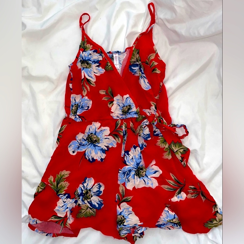 Red jumpsuit with blue floral print